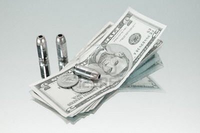silver-bullet-on-stack-of-money